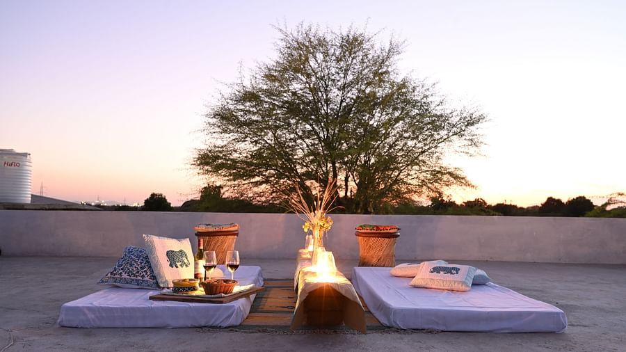 Clarks Safari Jawai - the rooftop seating arrangement with a bonfire between two mattresses