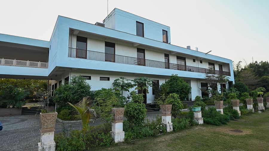 Facade of a big white  building  with lawn in front - Clarks Safari, Ranthambore