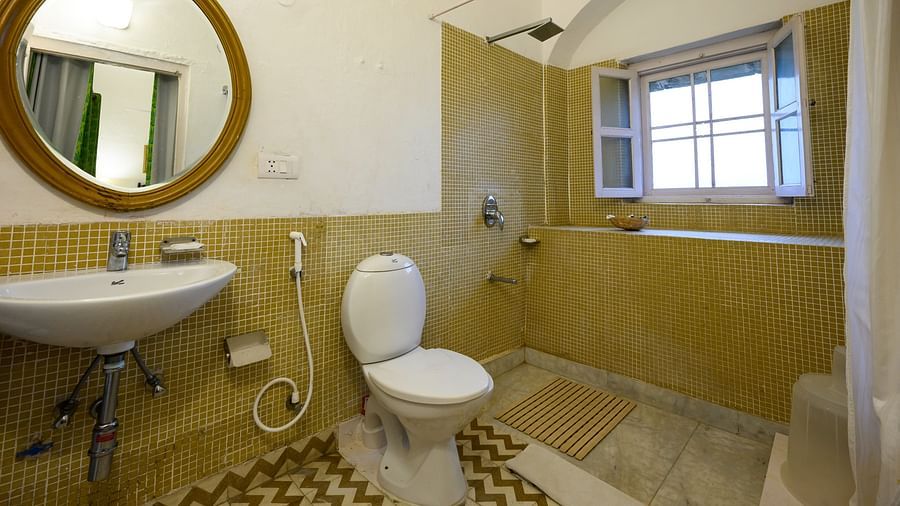 Hill Fort Kesroli 14th Century Alwar - interior view of the Hariyal Bathroom featuring a commode, wash basin and a mirror