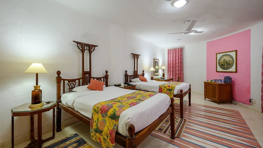 Hill Fort-Kesroli 14th Century Alwar - View of the Rawal Mahal room with twin beds and a lamp on either side