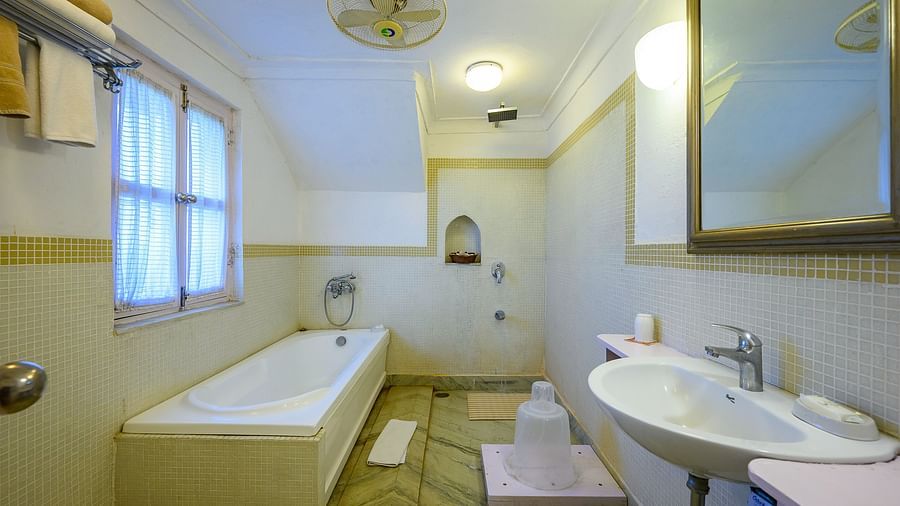 Hill Fort Kesroli 14th Century Alwar - interior view of the Simurgh Mahal Washroom with a bathtub, wash basin and a mirror
