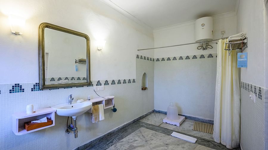 Hill Fort Kesroli 14th Century Alwar - Interior view of the Sugni Mahal - Countryside View Washroom with a shower space, mirror and a wash basin