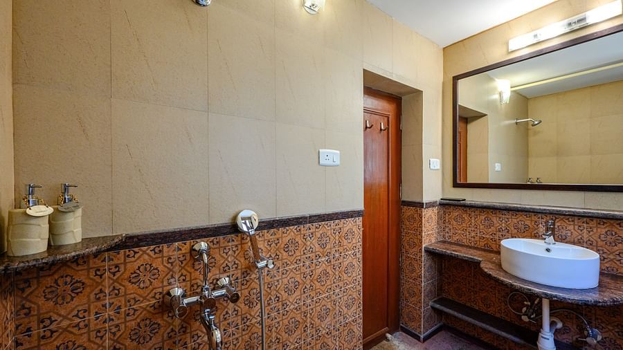 An overview of the bathroom inside Mitras - River View - River View room at neemrana s three waters
