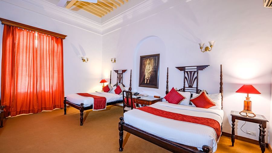twin double beds with lamps on the side inside Maharaja Bhupinder Singh room - The Baradari palace