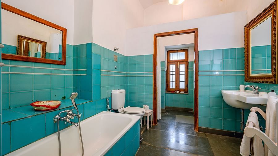 An overview of the bathroom showcasing a tub and wash basin inside Maharaja Amarinder Singh room - The Baradari Palace