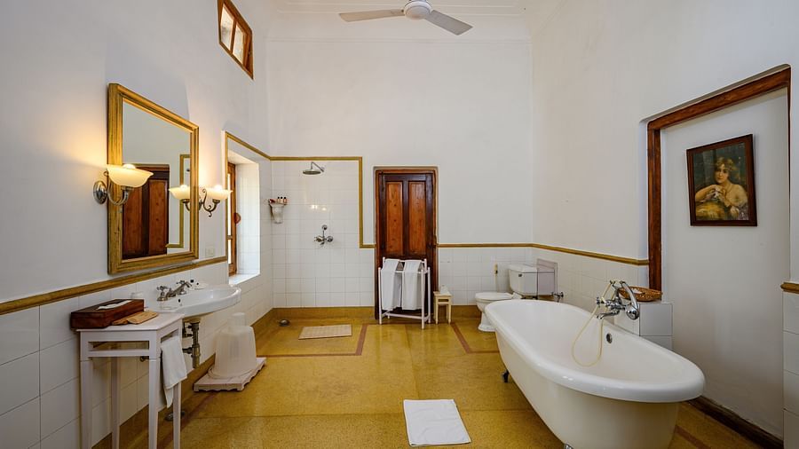An overview of the bathroom showcasing the tub and wash basin inside Rani Fateh Kaur room - The Baradari palace