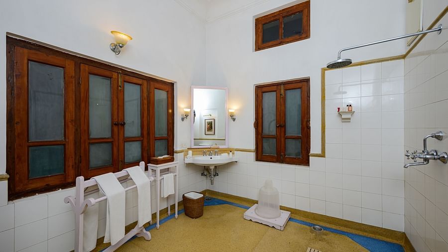 An overview bathroom showcasing the shower area and wash basin inside the Maharaja Narinder Singh room - The Baradari palace
