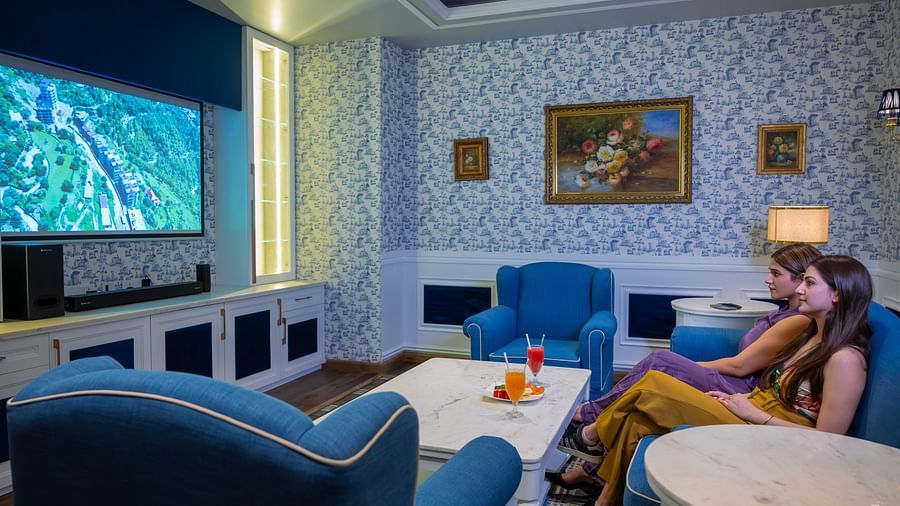 An image of two women sitting in a seating room -The Manor Luxury Apartments, Shimla