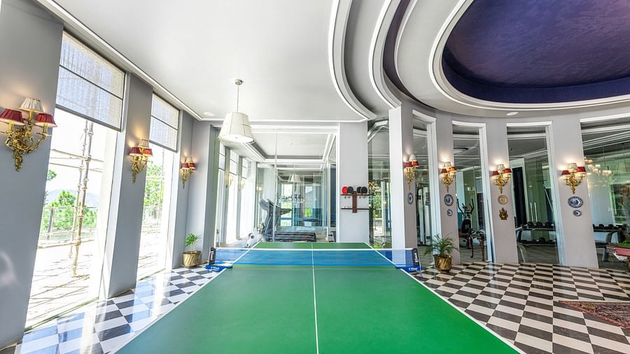 A picture of table tennis table in a room with ambient lighting -  The Manor Luxury Hotel, Shimla