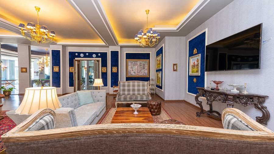 The club house with comfortable furniture and wall mounted television for entertainment - The Manor Luxury Hotel, Shimla