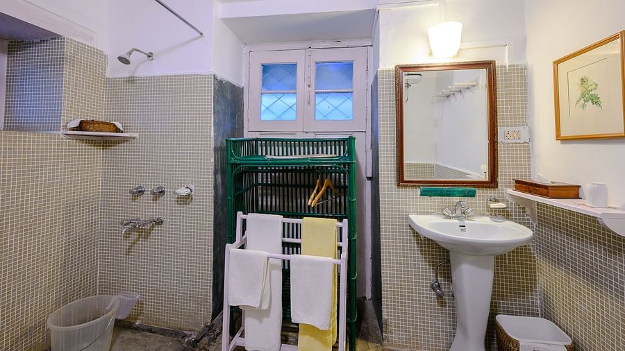Kashmir room's bathroom with separate shower space, a towel hanger and wash basin - Ramgarh Bungalows, Nainital.
