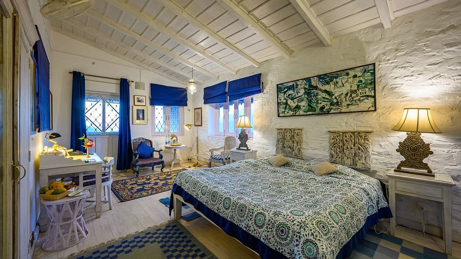 Ram Kumar room with cosy a double bed, side lamps and tables - Ramgarh Bungalows, Nainital.