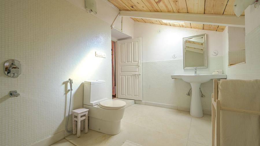 An overview of the bathroom with sink area in view - Ramgarh Bungalows, Nainital.
