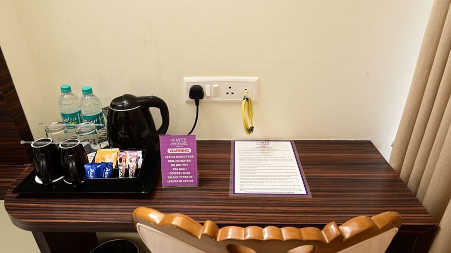 a side table with refreshments on top of it inside one of the rooms - VITS shanti solitaire, North Goa