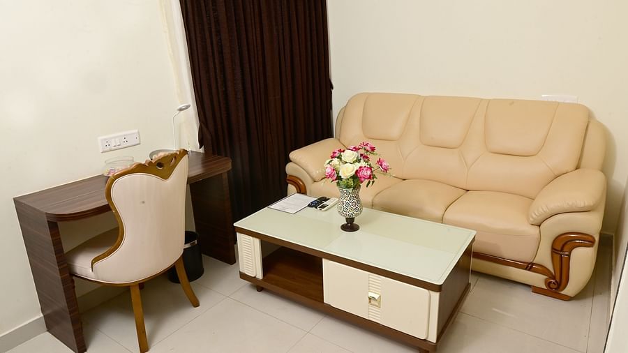 a study table, coffee table in front of the sofa at one of the rooms at VITS shanti solitaire, North Goa