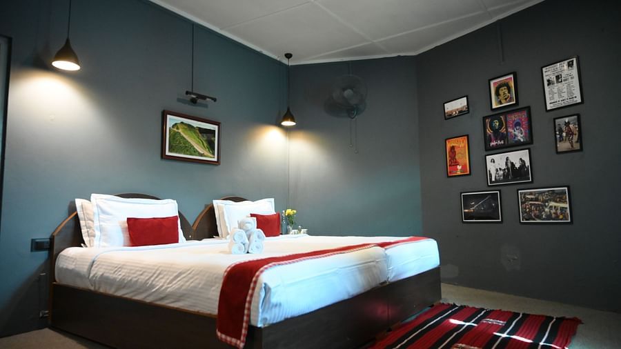 Double bed with artfully arranged wall frames
