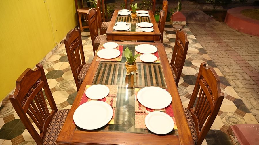 Dining table at Zestful Bites Restaurant in McCluskieganj