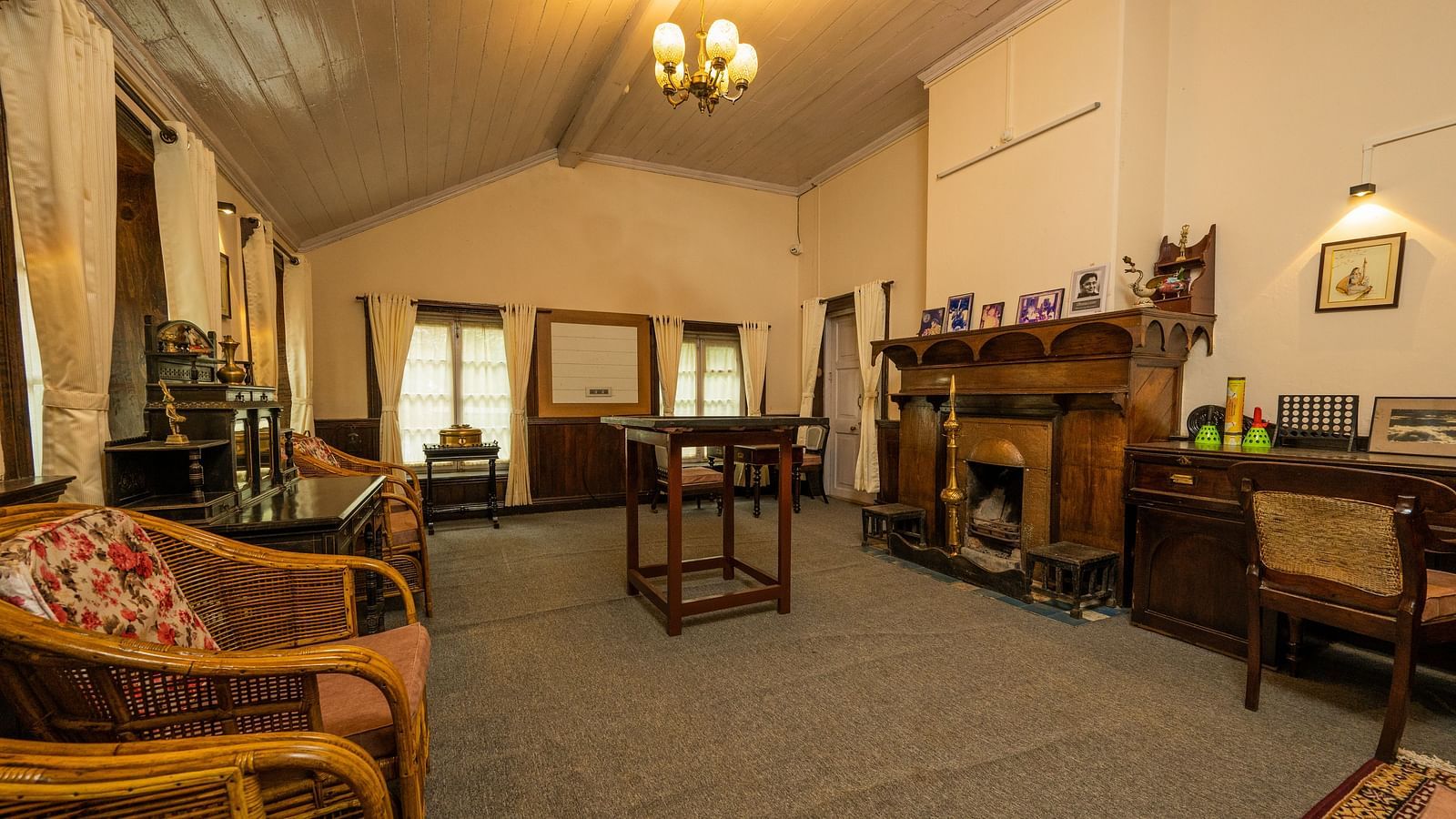 A right angle view of a spacious Gaming room with wooden furnished table and chair at Arcadia Heritage Resort, Darjeeling