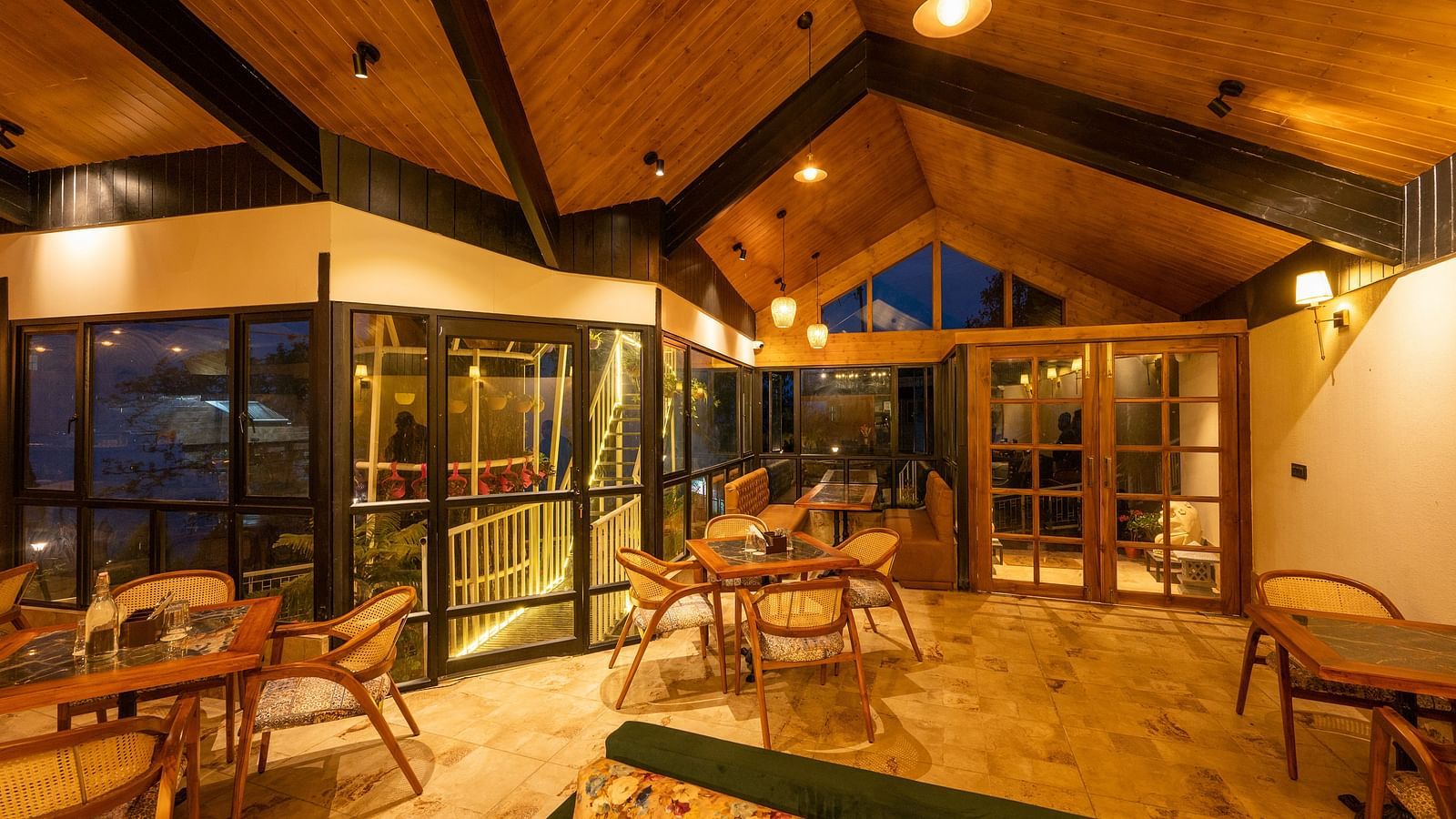 The beautifully decked up Treehouse cafe with wooden furnished- Arcadia Heritage Resort.