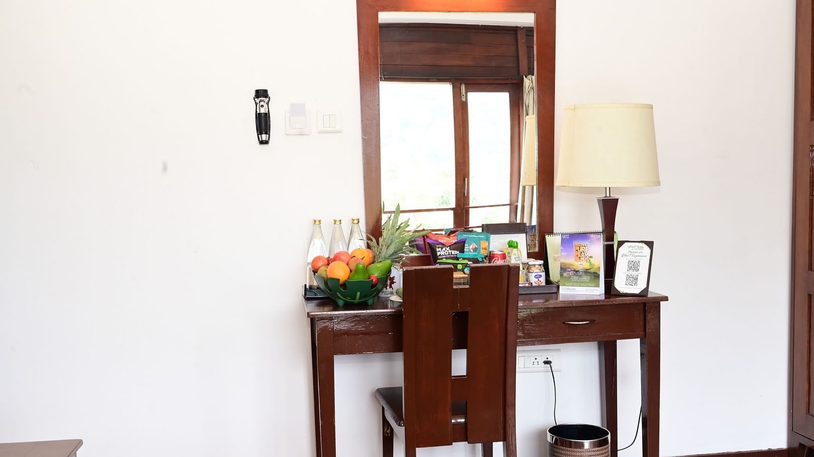 An image of a dressing table and a chair - GReaT trails Kodaikanal by GRT Hotels