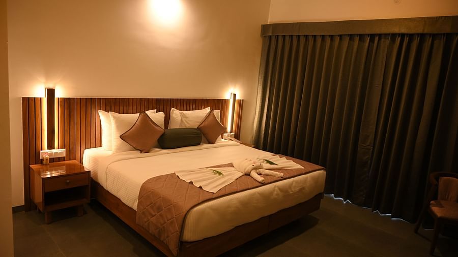 A double bed in the Deluxe Cottage at Mango Leaf Lake Resort, Pune