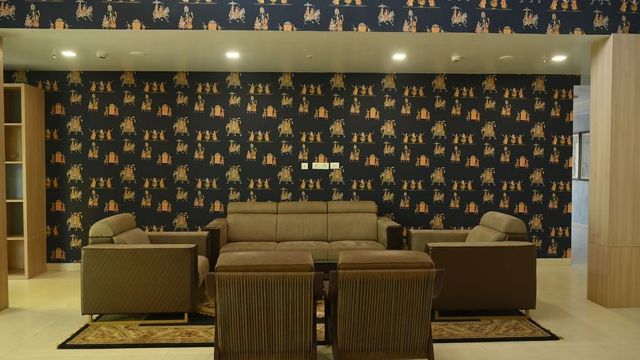 Blue wall and muddy sofas in the Lobby of MAYFAIR World Cup Village, Rourkela 2