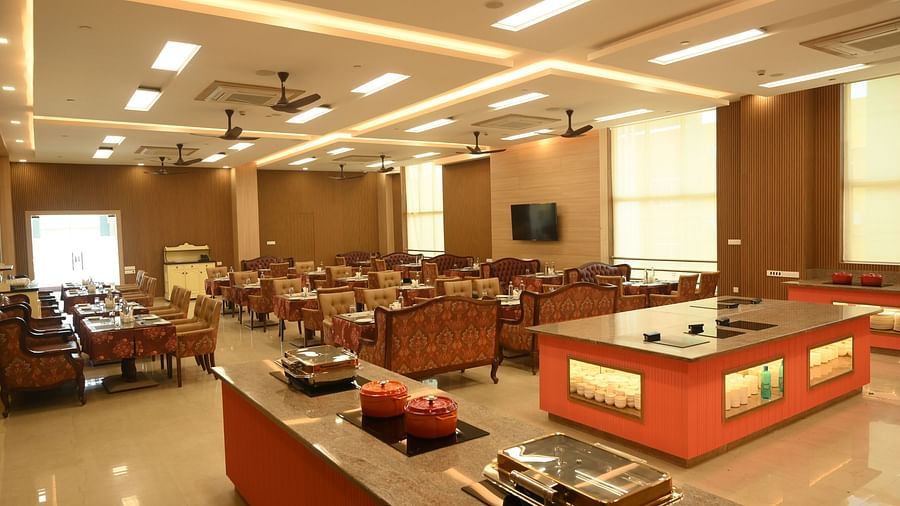 A buffet counter along with variety of seating at Scoop Restaurant at Mayfair World Cup Village, Rourkela 3