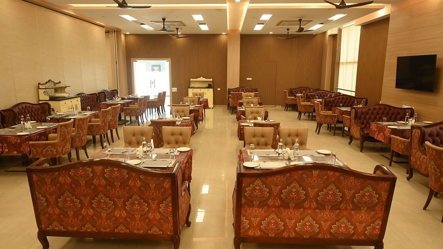 A variety of seating at Scoop Restaurant at Mayfair World Cup Village, Rourkela 4