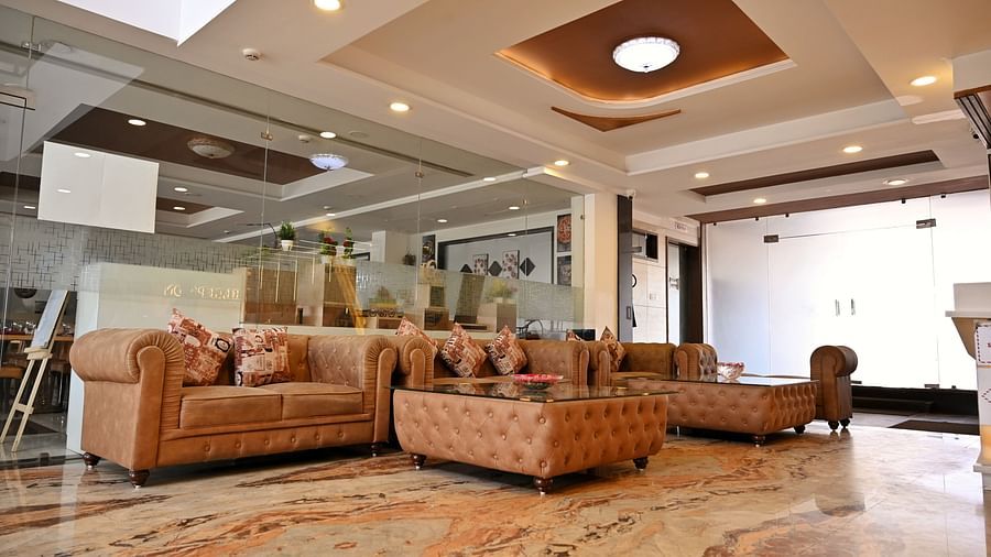 Lavish hotel lounge area with plush seating and sophisticated decor - TGI Insignia, Bhopal