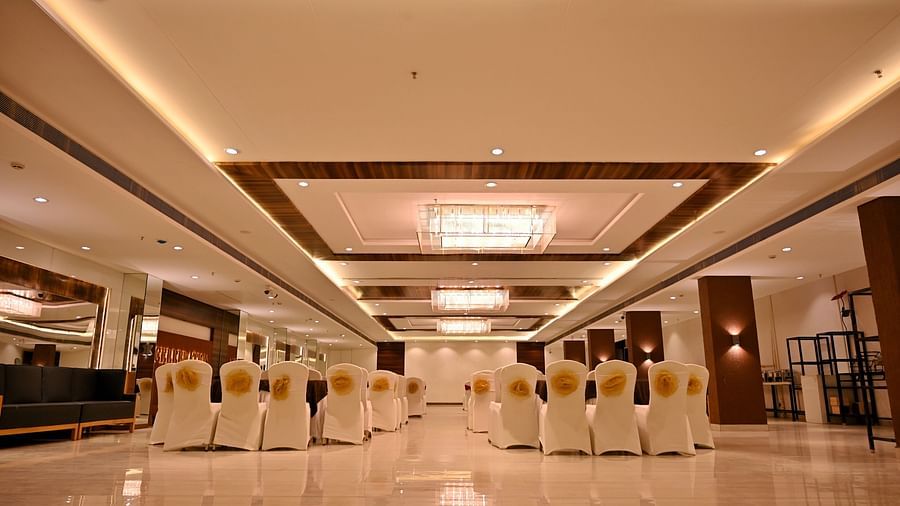 Well-arranged banquet hall at TGI Insignia with tables set for an event - TGI Insignia, Bhopal