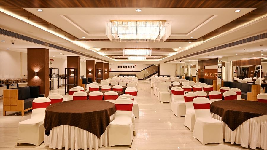 Elegant banquet hall with round tables, modern lighting and a chic interior - TGI Insignia, Bhopal