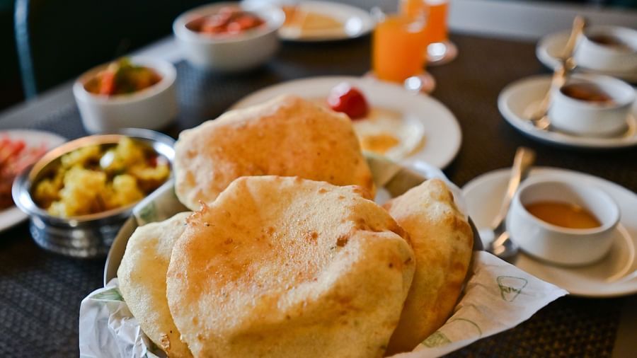 Image of puri and and other food items at  at The Soma Hotel by Avianna Group, Darjeeling