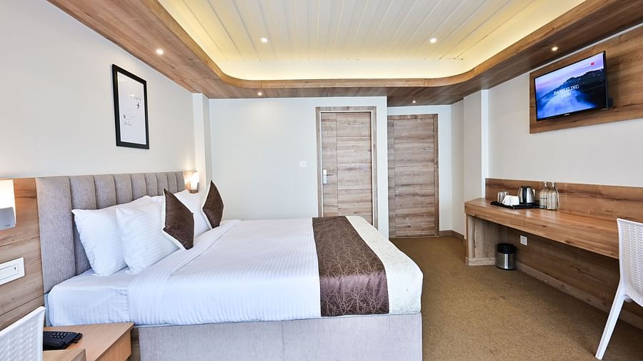 a brightly lit premium room with ample of natural light at the soma hotel by avianna group, darjeling