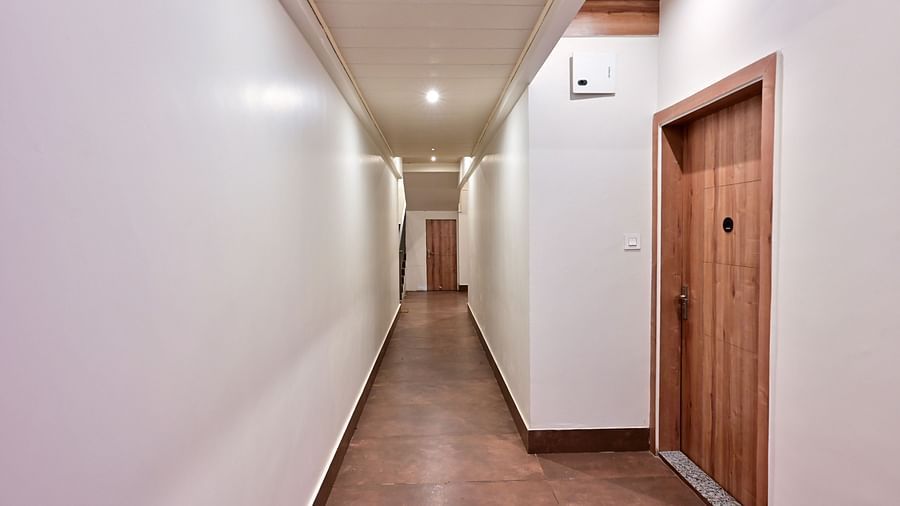 corridor with room doors at the soma hotel by avianna group, darjeeling