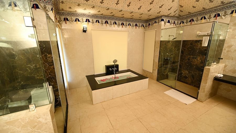 Washroom featuring a shower cubicle, a bathtub, and a separate toilet area - Clarks Safari, Ranthambore