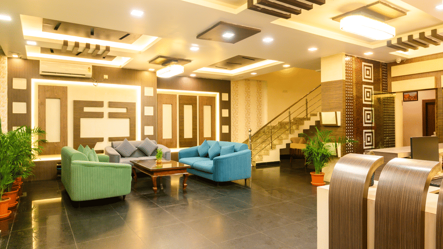 Hotel lobby entrance featuring sofa seating and stylish interior design at Biznotel by Pride, Deoghar