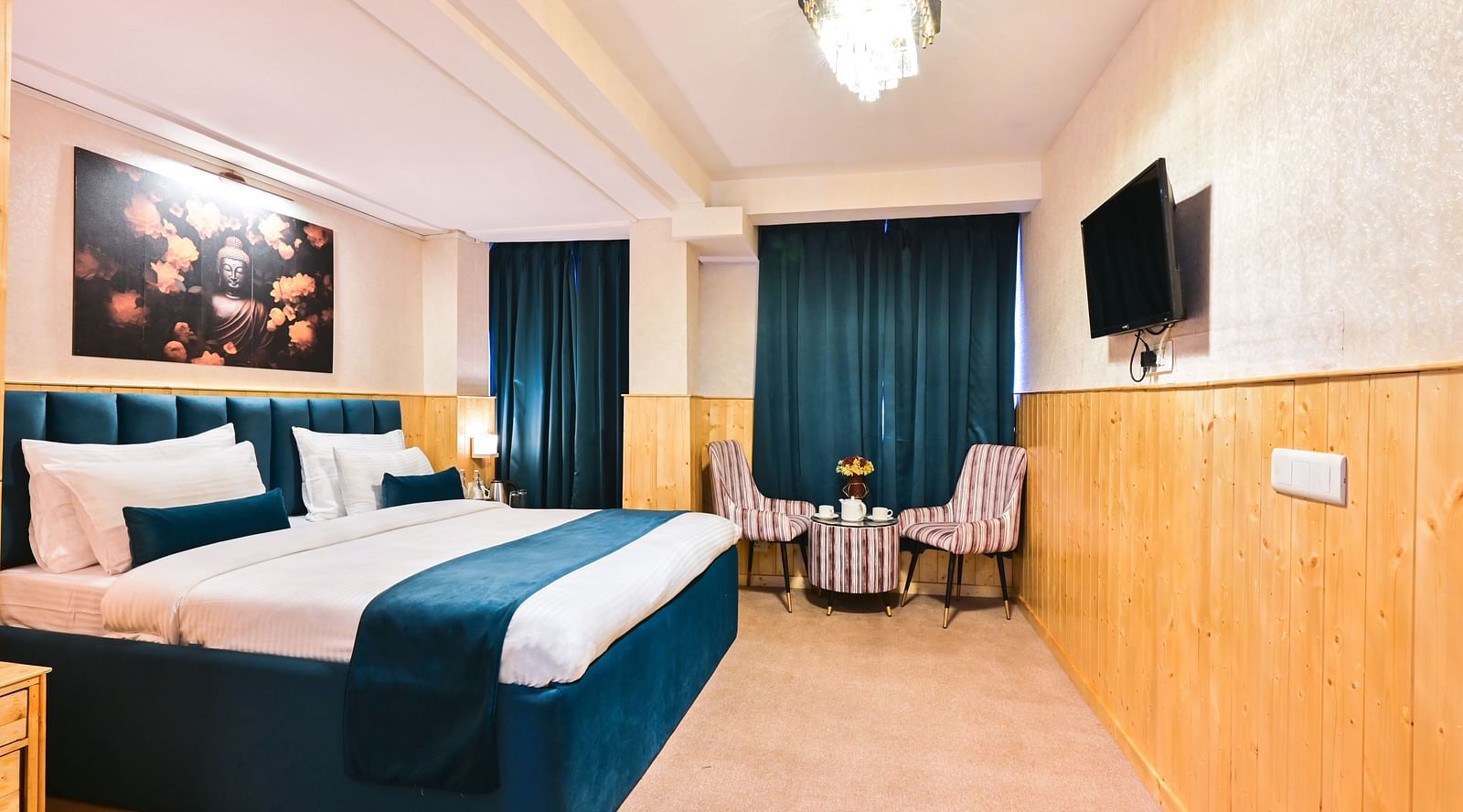 Deluxe Room with spacious bed, wooden furniture and warm lighitng at Avianna Seven Seas, Darjeeling1