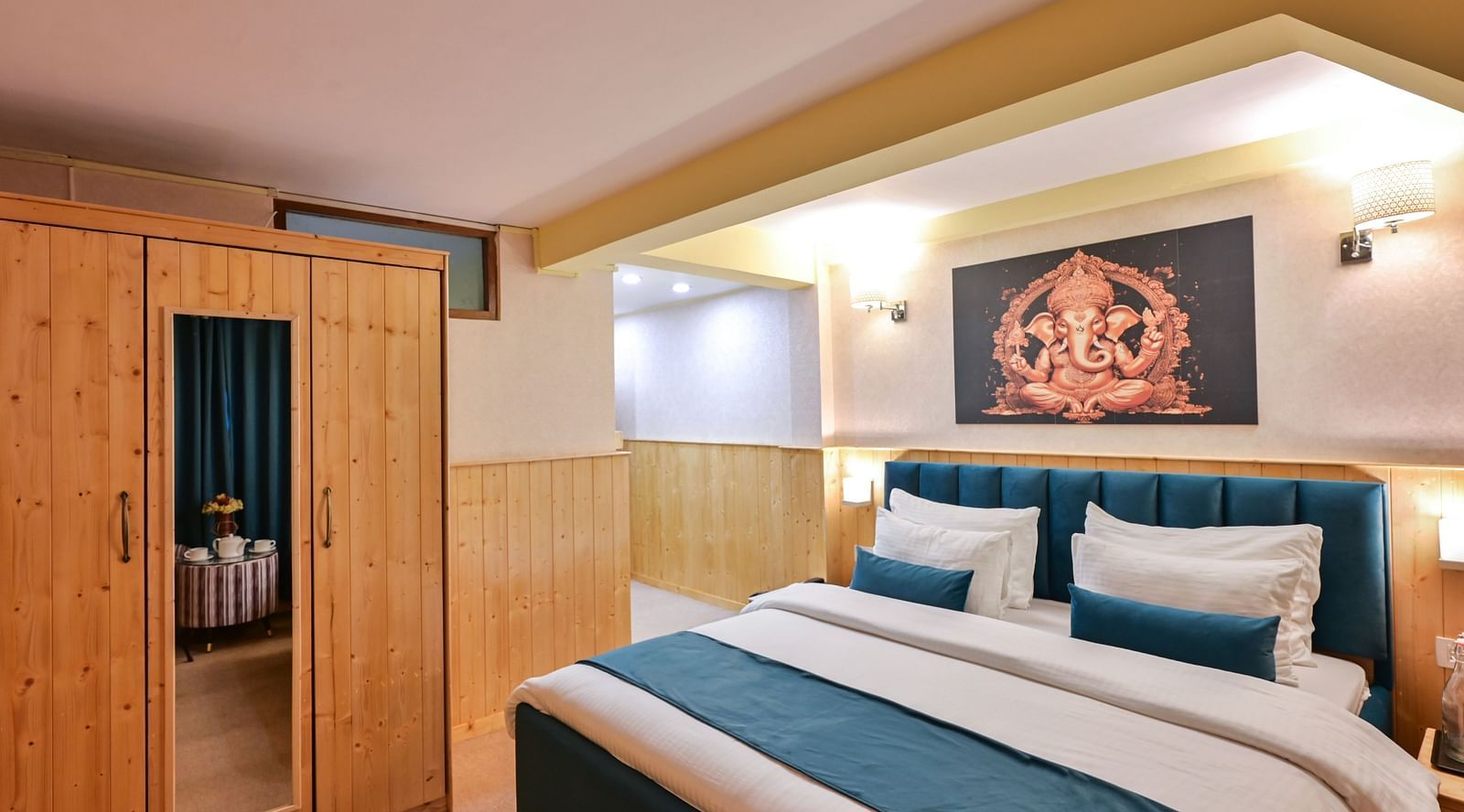 Deluxe Room with spacious bed, wooden furniture and warm lighitng at Avianna Seven Seas, Darjeeling11