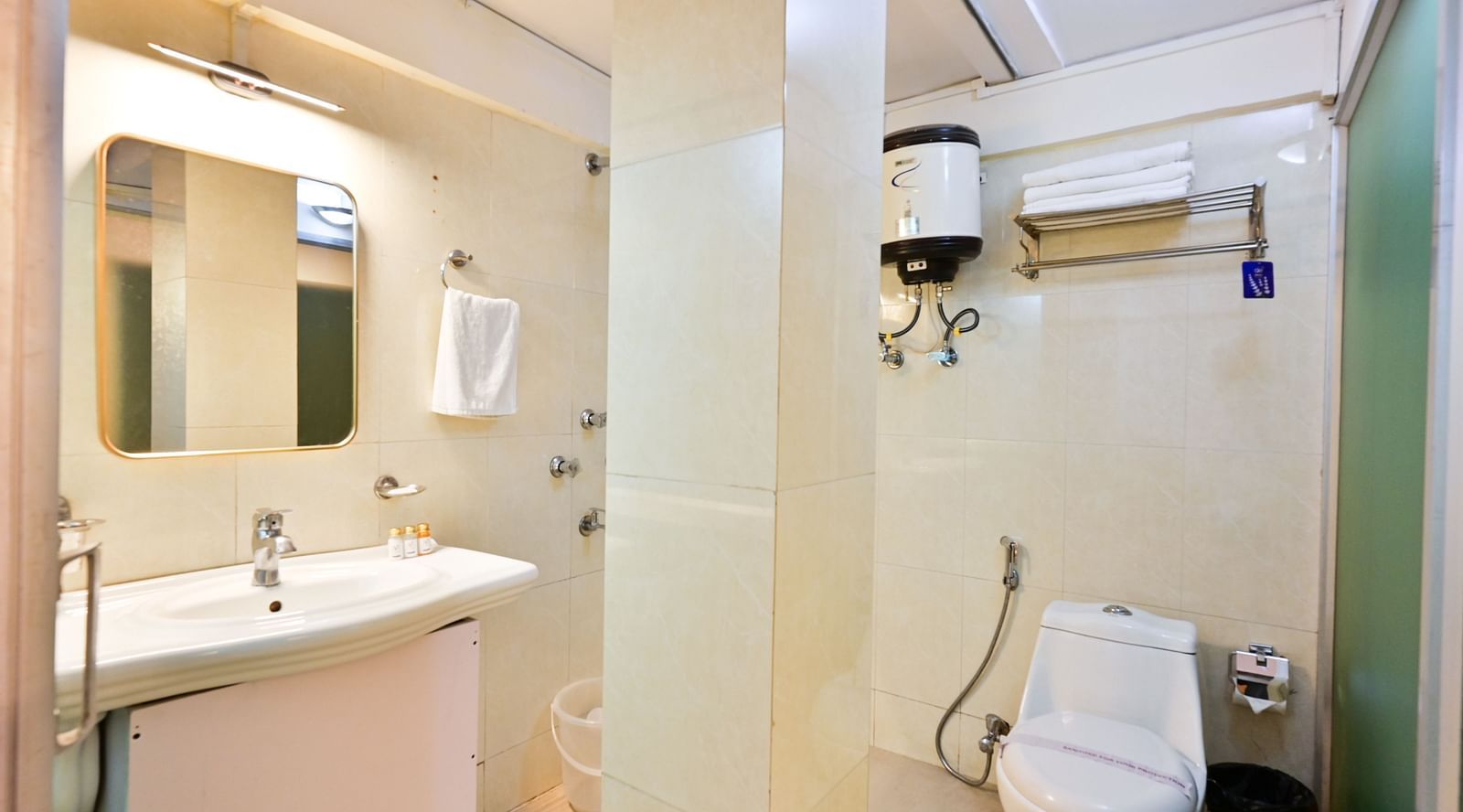 Deluxe Room with spacious bed, wooden furniture and warm lighitng at Avianna Seven Seas, Darjeeling8