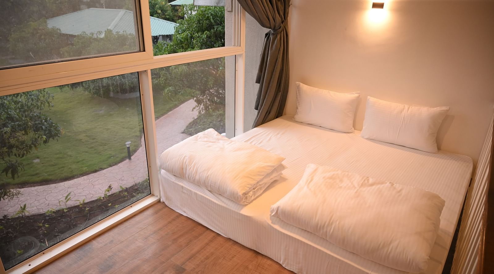 Front view of the mattress in the attic of the Kutumbh Suite at Mango Leaf Lake Resort, Pune