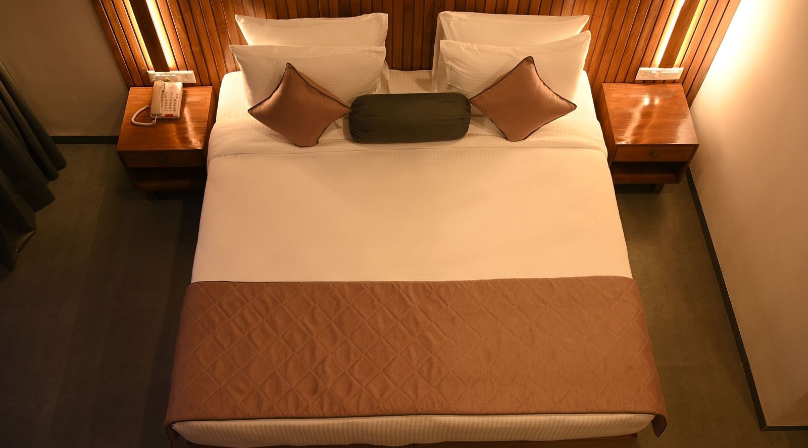 Top view of a double bed at the Kutumbh Suite at Mango Leaf Lake Resort, Pune