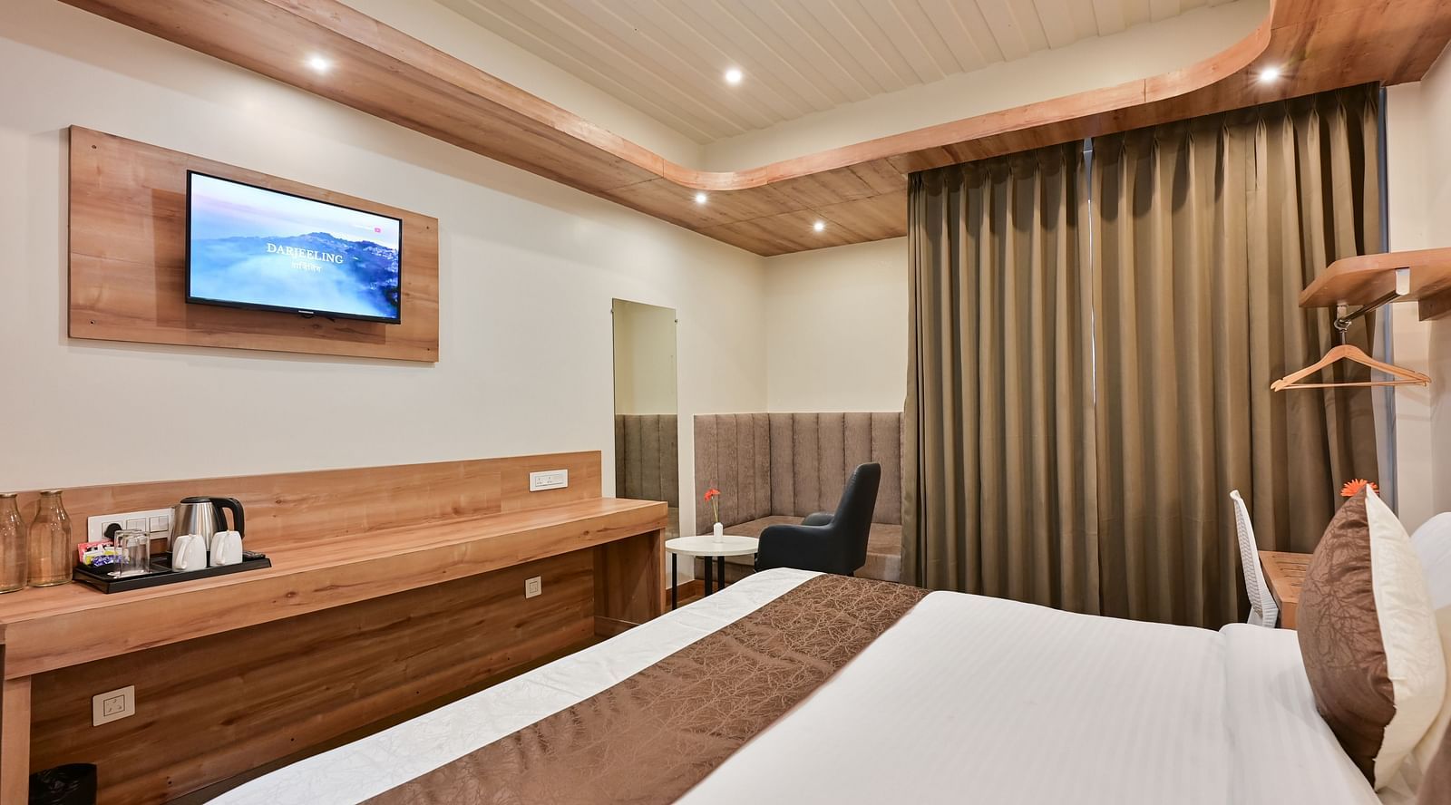 image of the deluxe room at the soma hotel by avianna group, darjeeling with  tea and coffee maker in the room