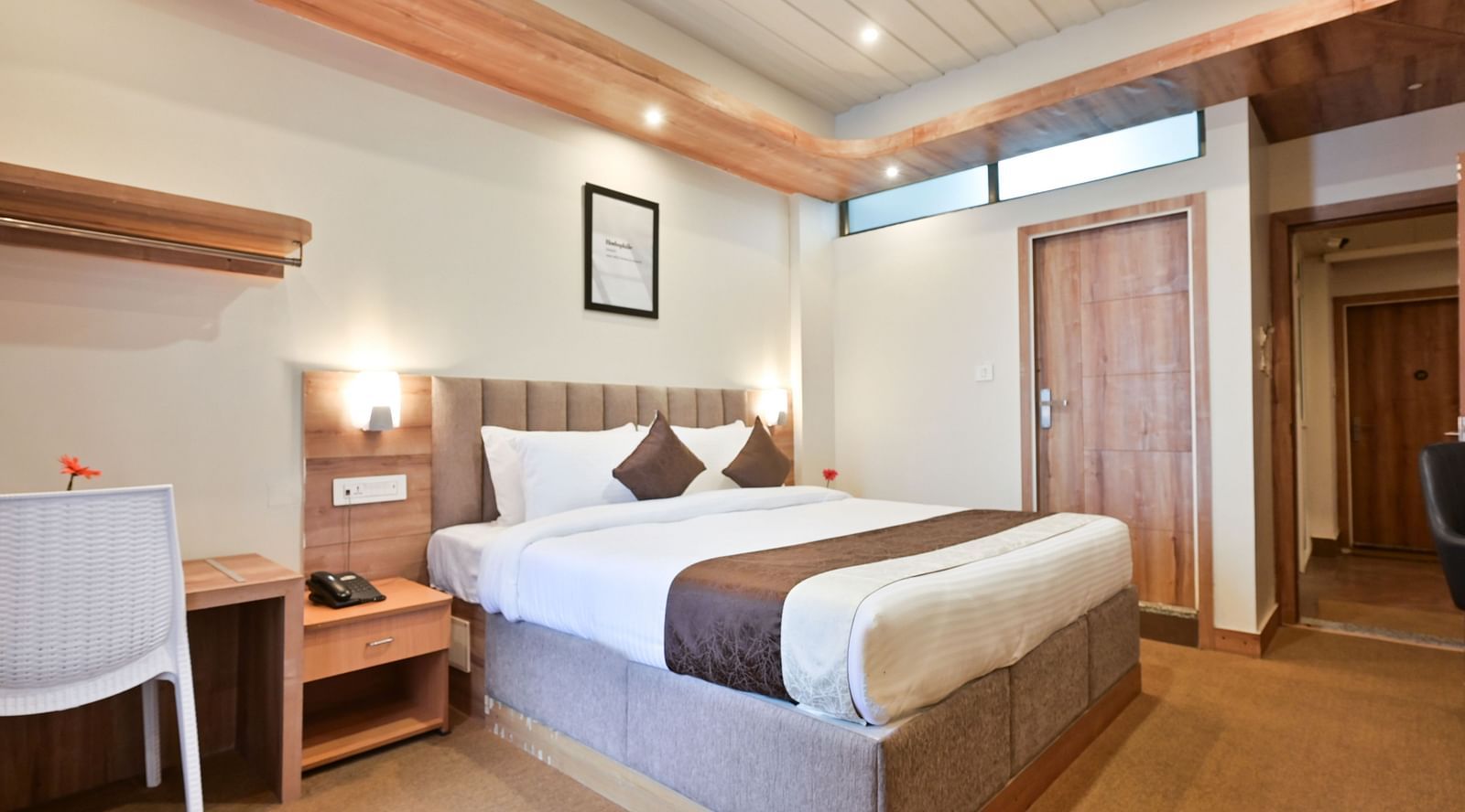 deluxe room with a work desk and a white chair at the soma hotel by avianna group, darjeeling