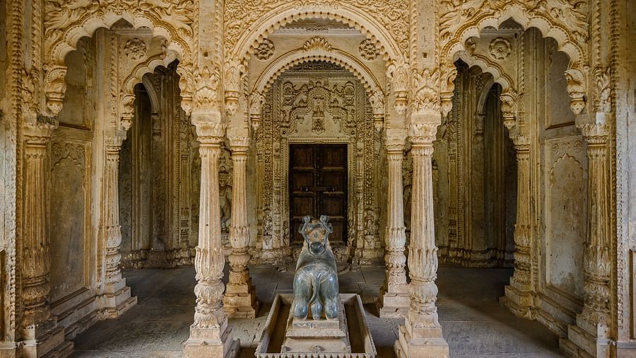 Deo Bagh - 17th Century, Gwalior - a statue of a sacred animal in front of an arch-shaped hallway