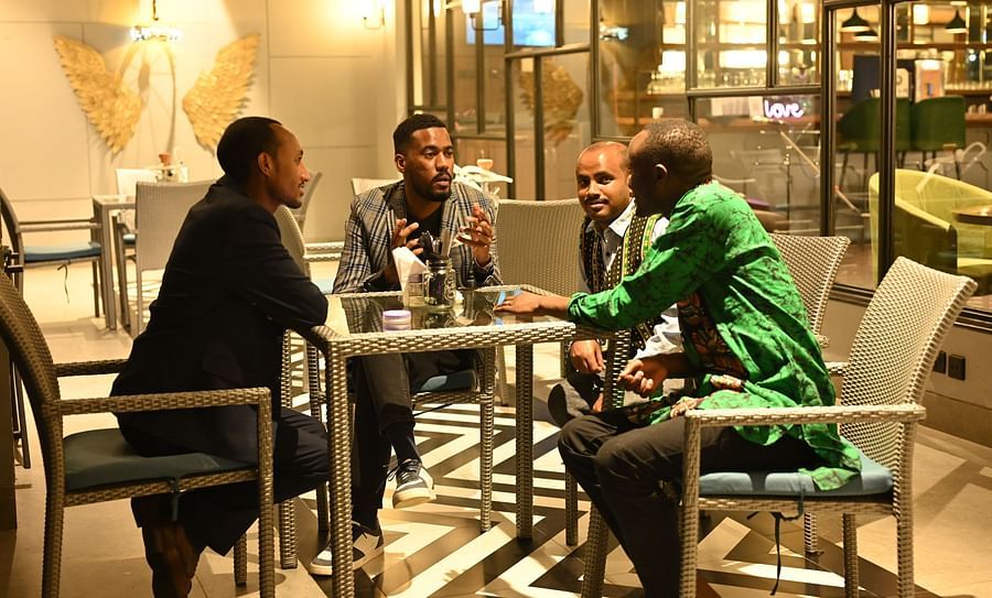 alt-text people sitting in a restaurant