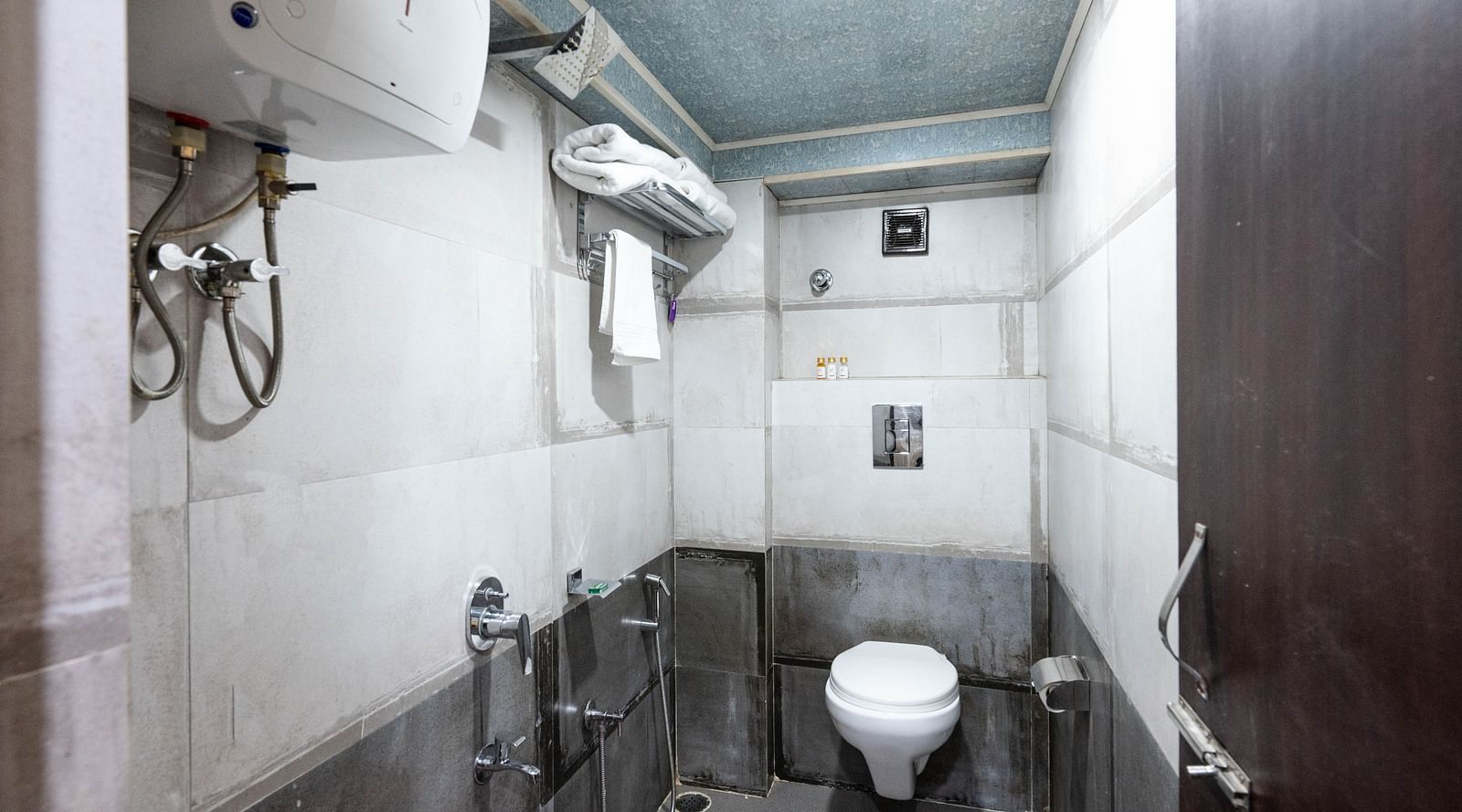 an image of standard room bathroom with a water heater at Avianna New Mandala Hotel & Spa, Darjeeling