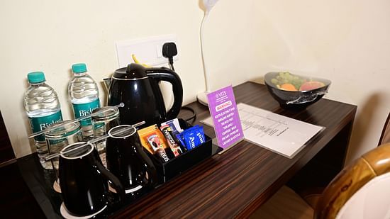 a study table with refreshments on top of it inside one of the rooms at VITS shanti solitaire, North Goa