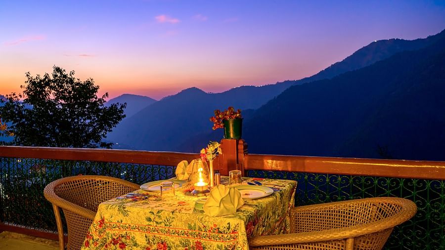 Night view of outdoor seating set-up overlooking the valley at The Ramgarh Bungalows - 19th Century, Above Nainital.