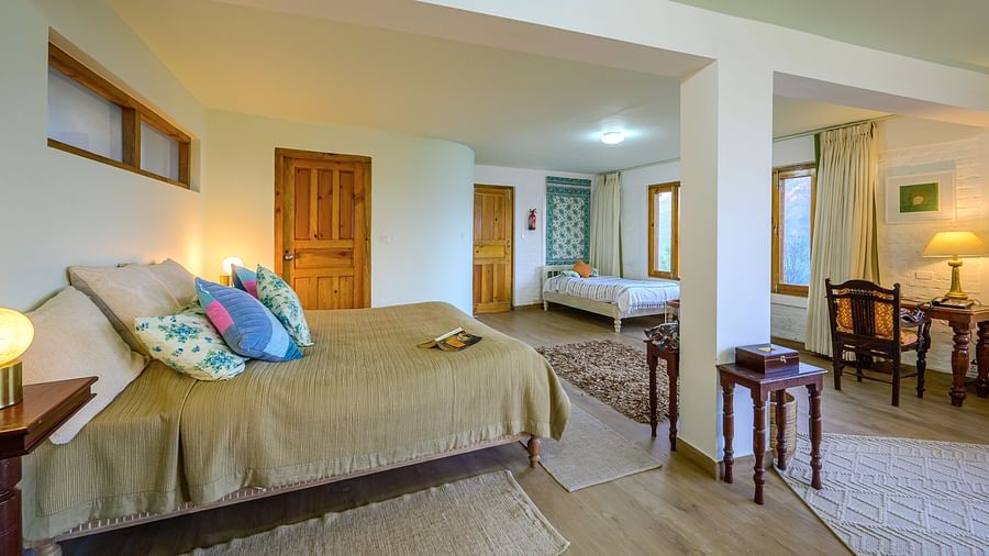 Fig room with spacious interiors, a double bed and a work desk at The Ramgarh Bungalows - 19th Century, Above Nainital.