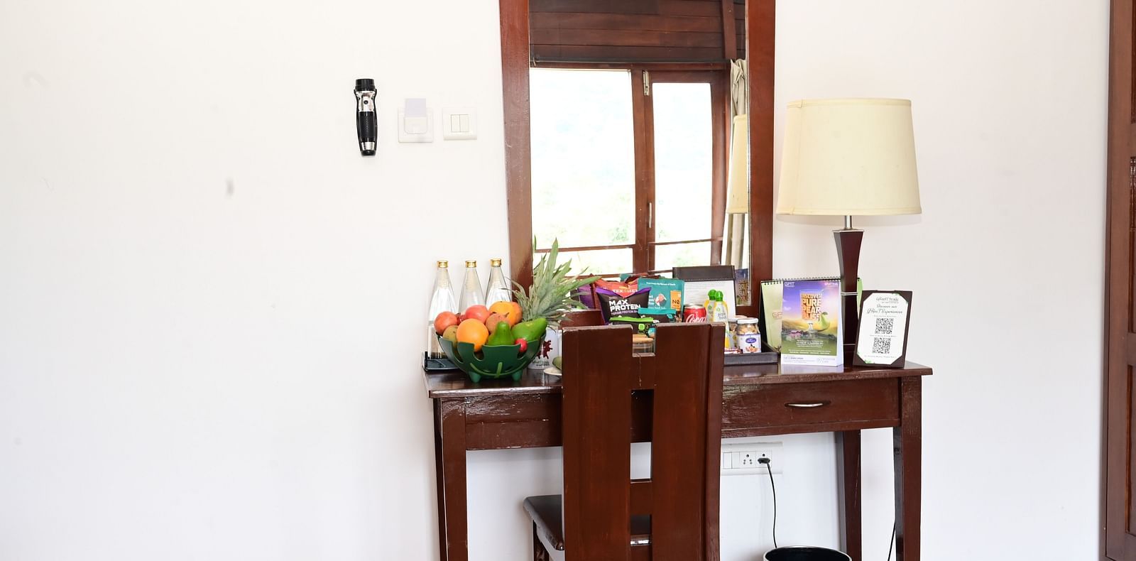 An image of a dressing table and a chair - GReaT trails Kodaikanal by GRT Hotels